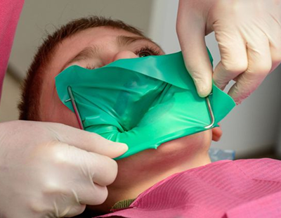 Patient having dental rubber dam placed